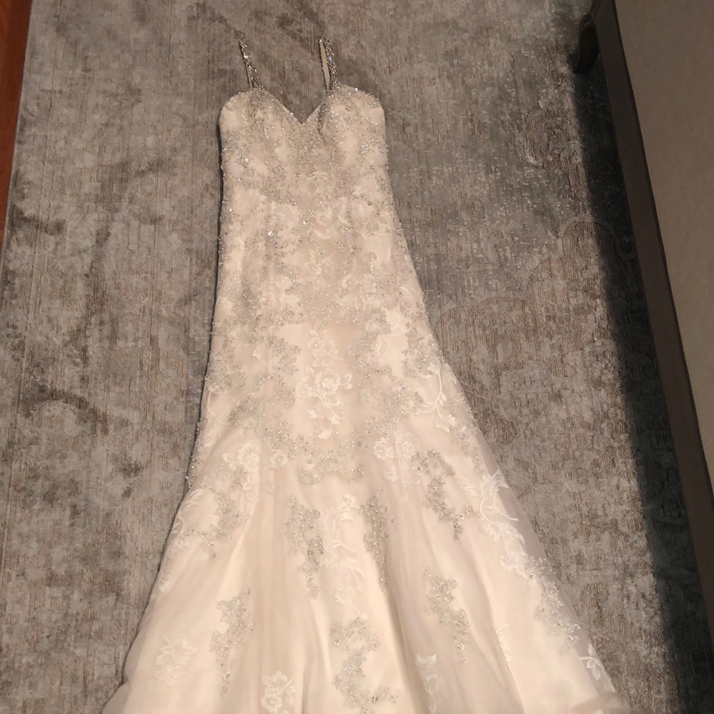 Ivory, lace, and beaded wedding gown